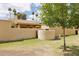 Exterior view of backyard with grass, tree, block fence and covered patio at 2116 W Marlette Ave, Phoenix, AZ 85015