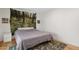 Bedroom with decorative forest mural, and a large rug at 2116 W Marlette Ave, Phoenix, AZ 85015