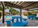 Inviting community pool area featuring picnic tables and lounge chairs for residents at 2116 W Marlette Ave, Phoenix, AZ 85015