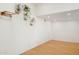 Bright open room with neutral walls, hardwood floors and ample room for custom design and decor at 2116 W Marlette Ave, Phoenix, AZ 85015