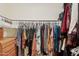 Well-organized walk-in closet features rod and shelving for ample storage; built-in drawers on the left at 2116 W Marlette Ave, Phoenix, AZ 85015