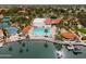 Expansive aerial view showcasing the community pool, tennis courts, and lush landscaping at 2218 E Anchor Dr, Gilbert, AZ 85234