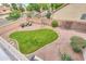 Aerial view of backyard, grass area and gravel area in the back with some furniture at 2218 E Anchor Dr, Gilbert, AZ 85234