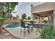 Inviting backyard featuring a pool, patio, seating, and lush landscaping at 2218 E Anchor Dr, Gilbert, AZ 85234