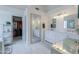 Elegant bathroom featuring double sinks, large mirror, and a walk-in closet at 2218 E Anchor Dr, Gilbert, AZ 85234