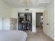 Bedroom features a closet with shelving and rod for ample storage at 2218 E Anchor Dr, Gilbert, AZ 85234