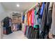 Spacious walk-in closet featuring built-in shelving and racks for organized storage of clothes and shoes at 2218 E Anchor Dr, Gilbert, AZ 85234
