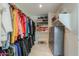 Organized walk-in closet with shelving, drawers, and ample hanging space for clothes and accessories at 2218 E Anchor Dr, Gilbert, AZ 85234