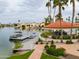 Beautiful waterfront community featuring a dock with boat slips and a gazebo-style lounge area with water views at 2218 E Anchor Dr, Gilbert, AZ 85234
