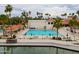 Aerial view of the community pool with lush landscaping and nearby amenities at 2218 E Anchor Dr, Gilbert, AZ 85234