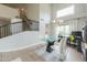 Dining area featuring a modern table, vaulted ceilings, and a staircase at 2218 E Anchor Dr, Gilbert, AZ 85234
