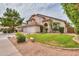 Charming two-story home with a well-manicured lawn, mature trees and a three-car garage at 2218 E Anchor Dr, Gilbert, AZ 85234