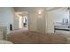 Carpeted hallway with several doorways and light fixtures, creating a welcoming atmosphere at 2218 E Anchor Dr, Gilbert, AZ 85234