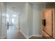 Bright hallway leads to the living room and showcases natural light and neutral tones at 2218 E Anchor Dr, Gilbert, AZ 85234