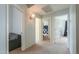 Hallway with carpet and neutral paint, showing access to other rooms in the home at 2218 E Anchor Dr, Gilbert, AZ 85234