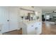 Bright kitchen featuring white cabinetry, stainless steel appliances, and an island with a white countertop at 2218 E Anchor Dr, Gilbert, AZ 85234