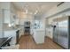 Modern kitchen featuring an island, stainless steel appliances, and plenty of storage space at 2218 E Anchor Dr, Gilbert, AZ 85234