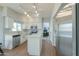 Well-equipped kitchen with stainless steel appliances, ample counter space, and white cabinetry at 2218 E Anchor Dr, Gilbert, AZ 85234
