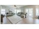 Spacious living room with plush seating, large windows, and access to the outdoor pool area at 2218 E Anchor Dr, Gilbert, AZ 85234