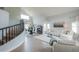 Bright living room with soaring ceilings, a staircase, and modern furniture at 2218 E Anchor Dr, Gilbert, AZ 85234