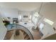 An overhead view of a bright living room with a modern chandelier and a curved staircase at 2218 E Anchor Dr, Gilbert, AZ 85234