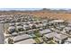 An expansive neighborhood with nicely landscaped homes is captured, set against the backdrop of desert landscapes at 22491 E Mewes Rd, Queen Creek, AZ 85142