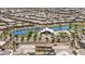 Aerial view of a Primary planned community shows lake, pool and recreation areas with houses surrounding at 22491 E Mewes Rd, Queen Creek, AZ 85142