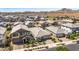 Beautifully landscaped homes are showcased in this aerial view, highlighting mountain views in the distance at 22491 E Mewes Rd, Queen Creek, AZ 85142