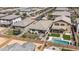 This aerial view highlights a backyard with a refreshing pool, trampoline, and a cozy outdoor seating area at 22491 E Mewes Rd, Queen Creek, AZ 85142