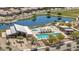 Aerial view of community pool features a lap pool, pool, covered seating and recreation center at 22491 E Mewes Rd, Queen Creek, AZ 85142