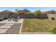 Large backyard featuring a fire pit, comfortable seating, and a well-kept lawn, perfect for outdoor enjoyment at 22491 E Mewes Rd, Queen Creek, AZ 85142