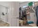 Bathroom featuring a walk-in closet, a glass-enclosed shower, and a window at 22491 E Mewes Rd, Queen Creek, AZ 85142