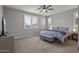 Serene primary bedroom with plantation shutters, plush carpet, and a calming color palette at 22491 E Mewes Rd, Queen Creek, AZ 85142