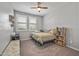 Cozy bedroom with natural light, neutral walls, and comfortable furnishings at 22491 E Mewes Rd, Queen Creek, AZ 85142