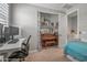 Bedroom featuring a desk, piano, and cozy sleeping space for relaxation at 22491 E Mewes Rd, Queen Creek, AZ 85142