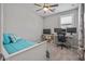 Bright bedroom featuring a bed, workspace, and natural light through window at 22491 E Mewes Rd, Queen Creek, AZ 85142