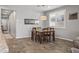 Cozy dining room with a wooden table and neutral color scheme for dining at 22491 E Mewes Rd, Queen Creek, AZ 85142