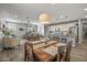 An open-concept dining room and kitchen layout with island seating at 22491 E Mewes Rd, Queen Creek, AZ 85142