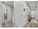 Hallway with decorative details, tiled flooring, and well-lit ambiance at 22491 E Mewes Rd, Queen Creek, AZ 85142