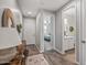 Hallway leading to bedroom and bathroom; features wood-look floors and neutral paint at 22491 E Mewes Rd, Queen Creek, AZ 85142