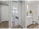 Hallway with views to bedroom and bathroom, featuring wood-look floors at 22491 E Mewes Rd, Queen Creek, AZ 85142