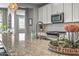 Close-up on the kitchen island with granite countertops, stylish sink, and stainless steel appliances at 22491 E Mewes Rd, Queen Creek, AZ 85142