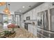 The kitchen has stainless steel appliances, a large island, and a breakfast bar at 22491 E Mewes Rd, Queen Creek, AZ 85142