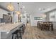 Spacious kitchen with island seating open to dining area, providing a stylish space at 22491 E Mewes Rd, Queen Creek, AZ 85142