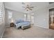 The owner's suite features a plush carpet, plantation shutters, and ensuite bathroom at 22491 E Mewes Rd, Queen Creek, AZ 85142