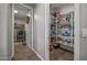 Hallway with access to a laundry room and a pantry with shelving for storage at 22491 E Mewes Rd, Queen Creek, AZ 85142