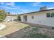 Well-maintained backyard with brick walk way to the exterior of the home at 2424 E Fairfield St, Mesa, AZ 85213