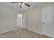 Bedroom with plush carpet, ceiling fan and neutral-toned walls at 2424 E Fairfield St, Mesa, AZ 85213