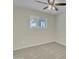 Bedroom with plush carpet, ceiling fan and neutral-toned walls at 2424 E Fairfield St, Mesa, AZ 85213