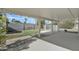 A covered patio overlooks the backyard with a pool and fencing at 2424 E Fairfield St, Mesa, AZ 85213